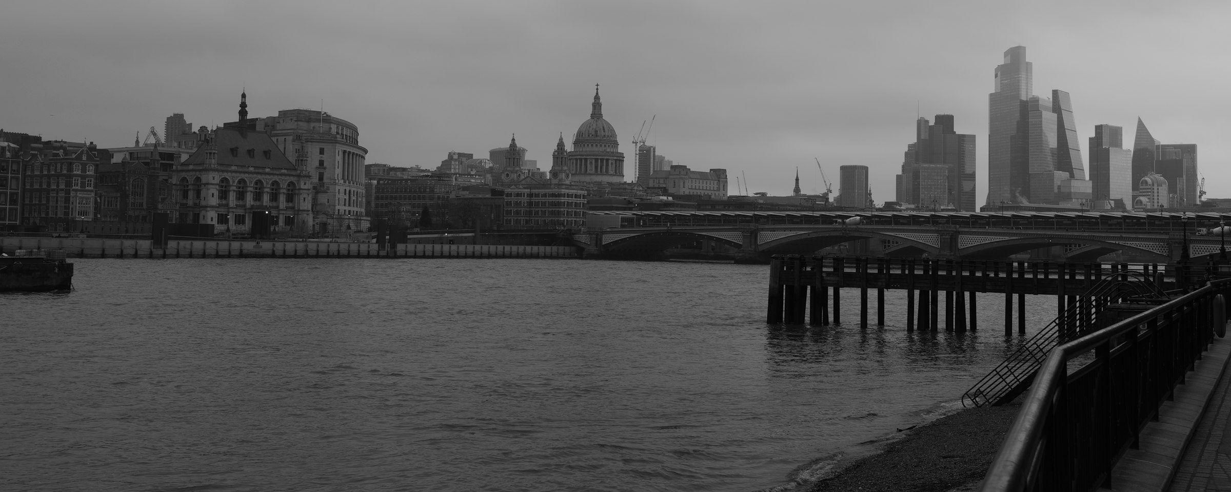The Thames under a grey sky, St Paul's and the City across the river